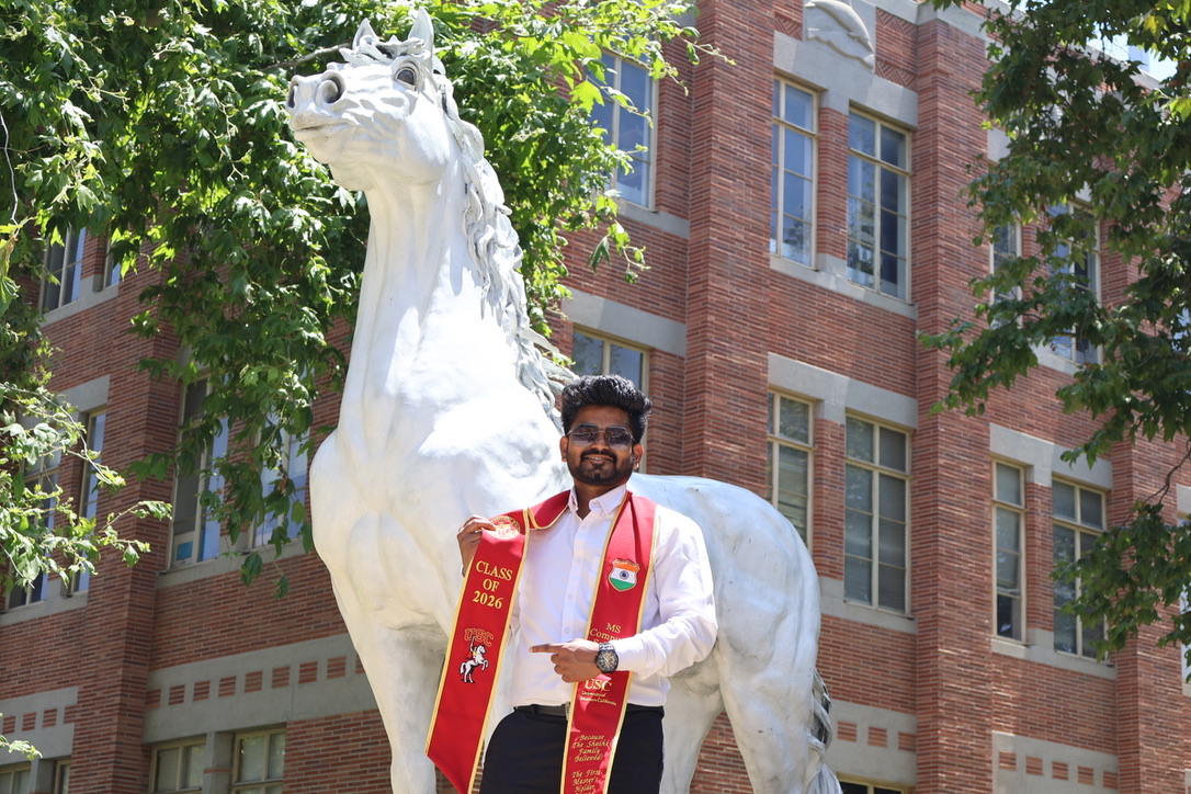 Sajid Shaikh with the USC Trojan horse statue